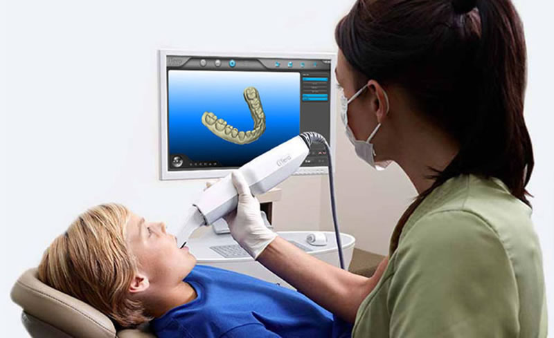 dentist taking scan for Invisalign