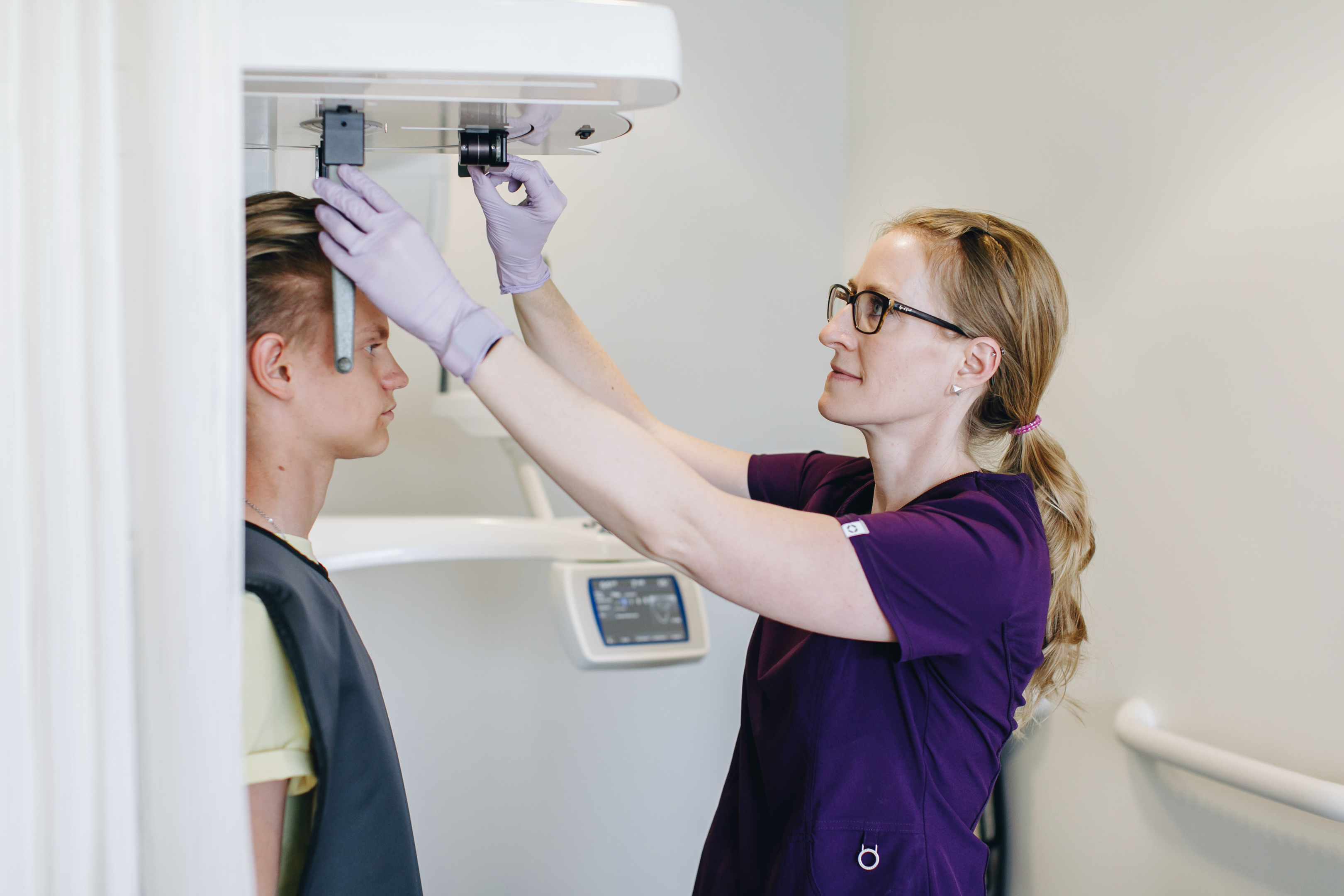 an orthodontist in Calgary, Alberta taking an x-ray for braces