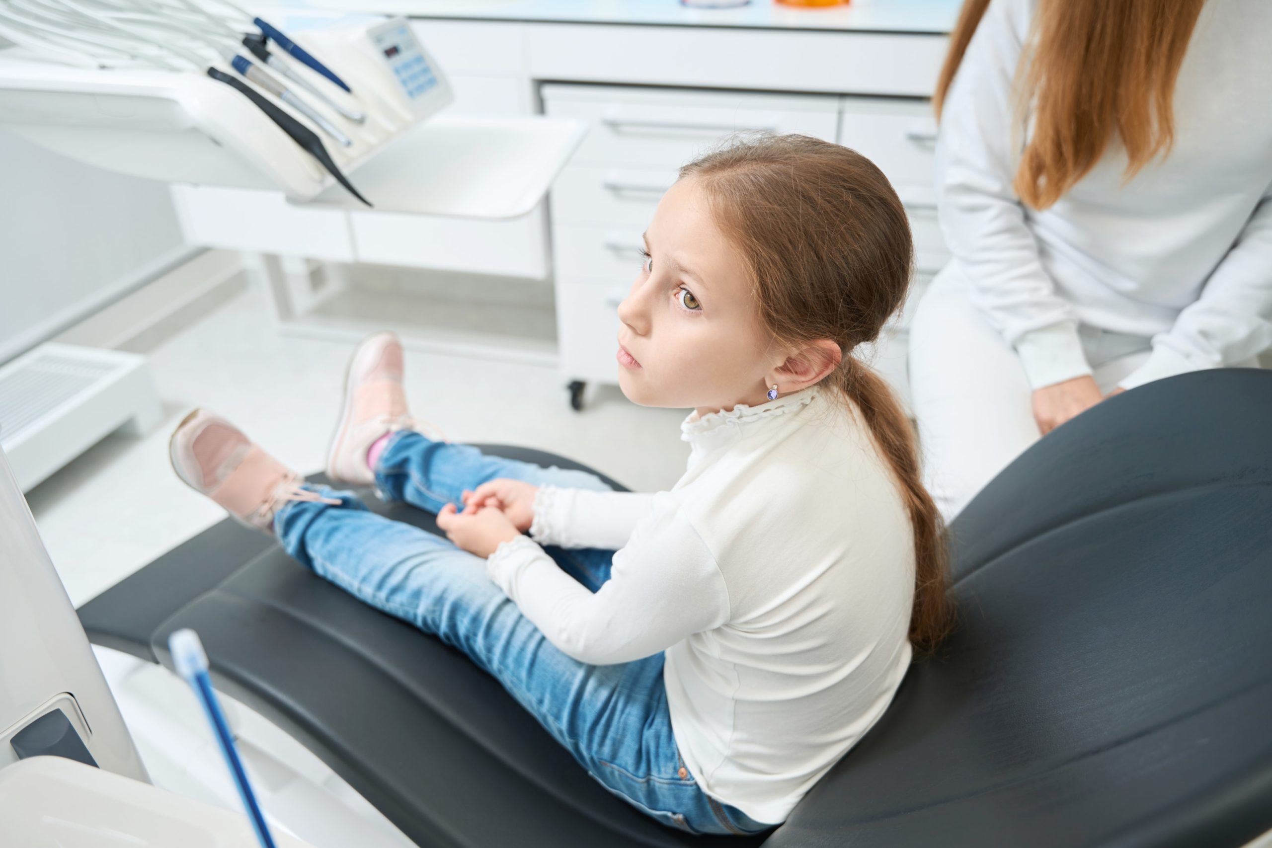 Kid sitting in patient chair