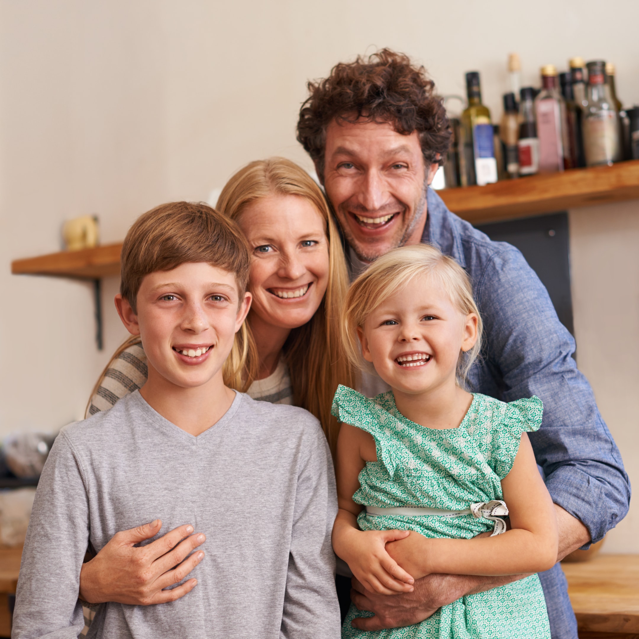 Parents smiling with their two kids