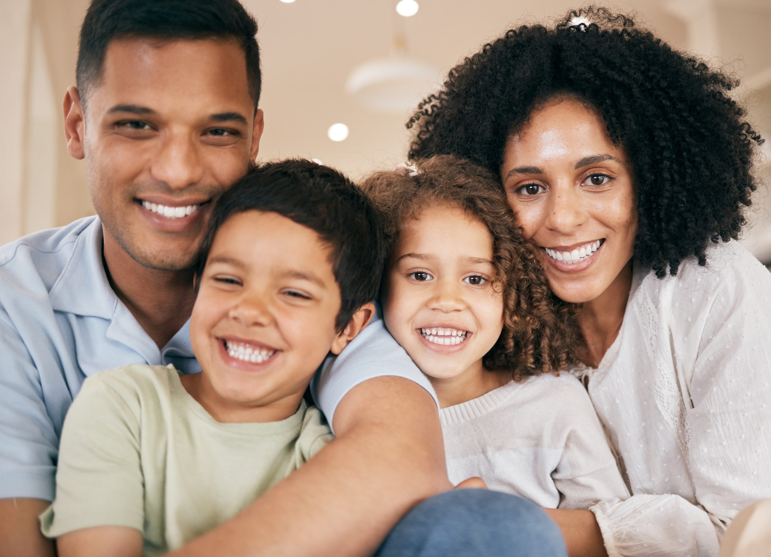 Family smiling after a tooth alignment consultation