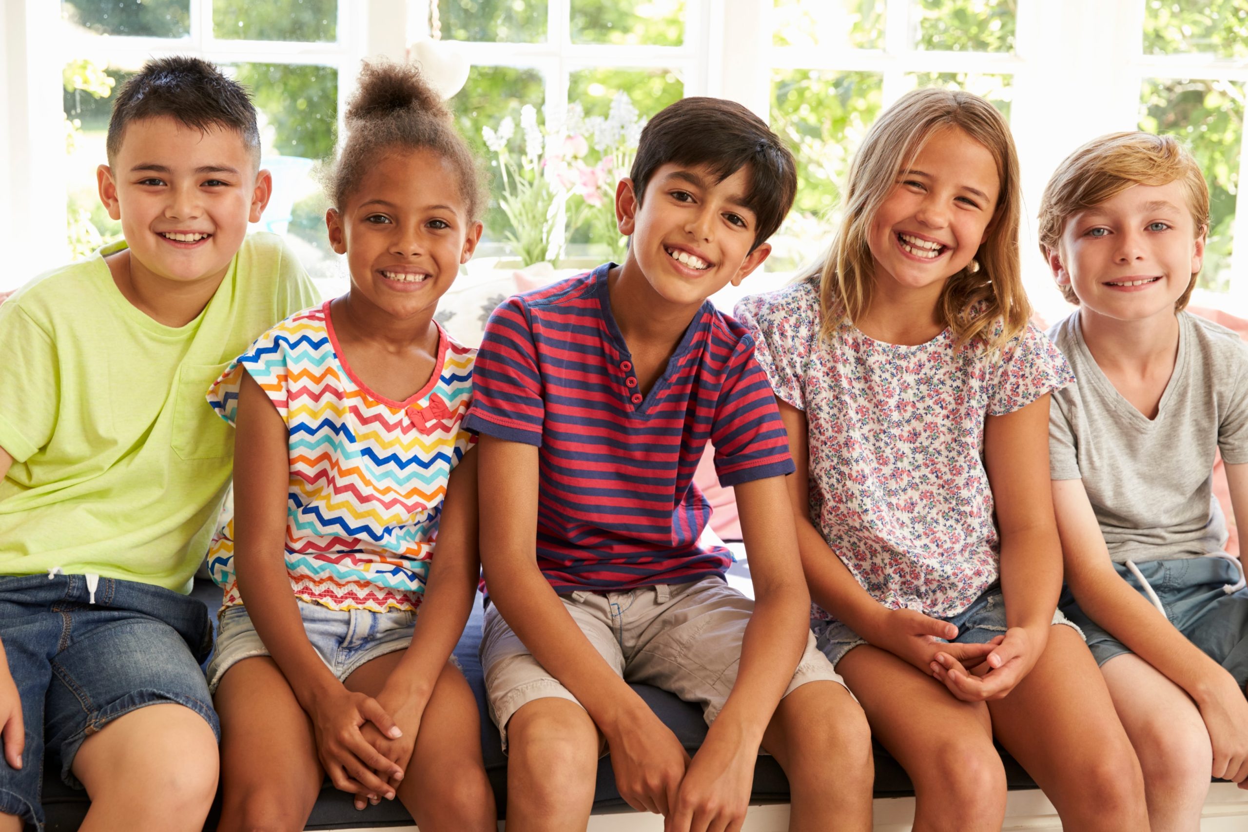 a group of smiling kids who are excited to start their orthodontic journey