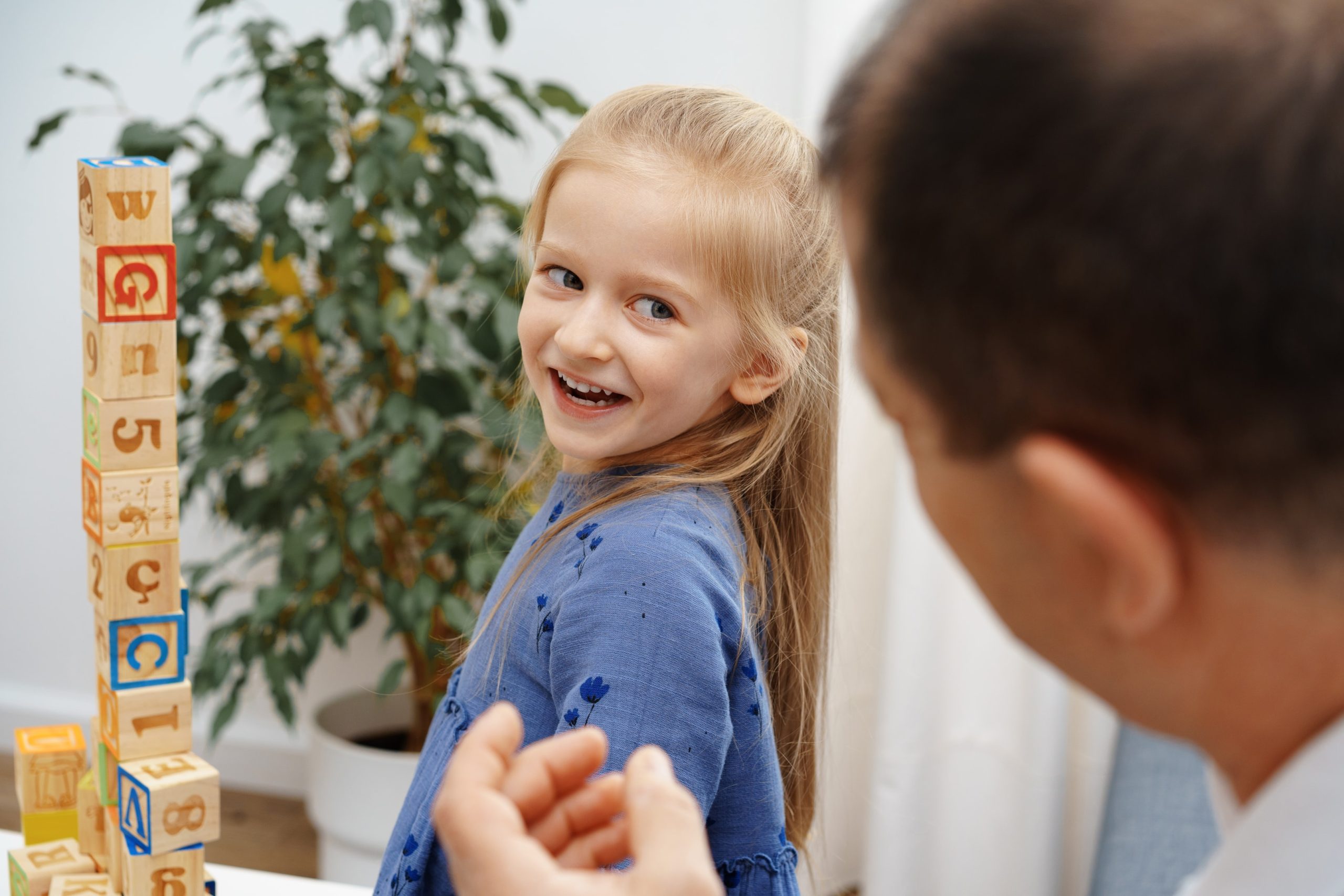 a 7 year old girl going into their first orthodontic appointment to track the growth and development of their baby teeth to easier create a treatment plan in the future