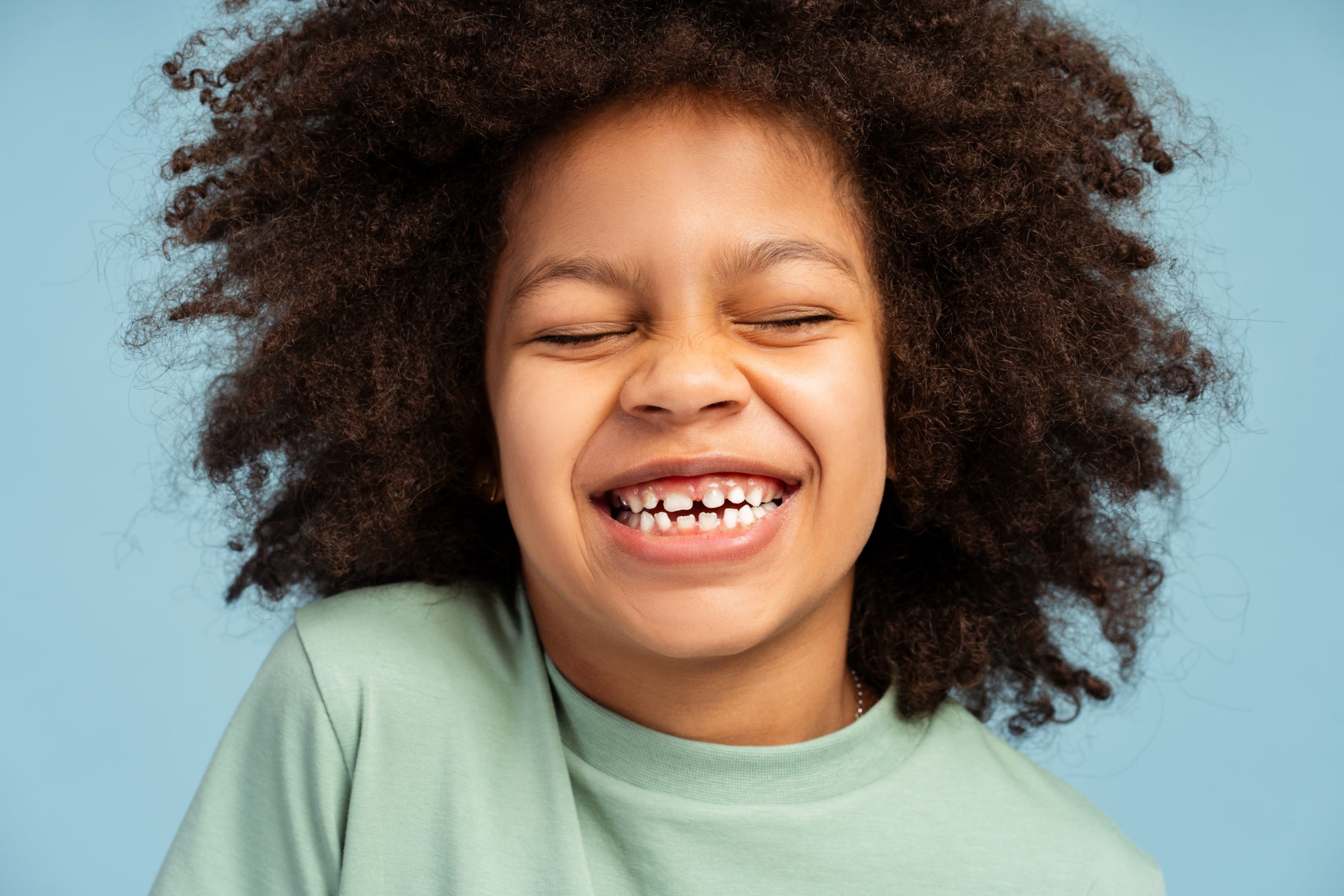 Kid smiling with a slight gummy smile