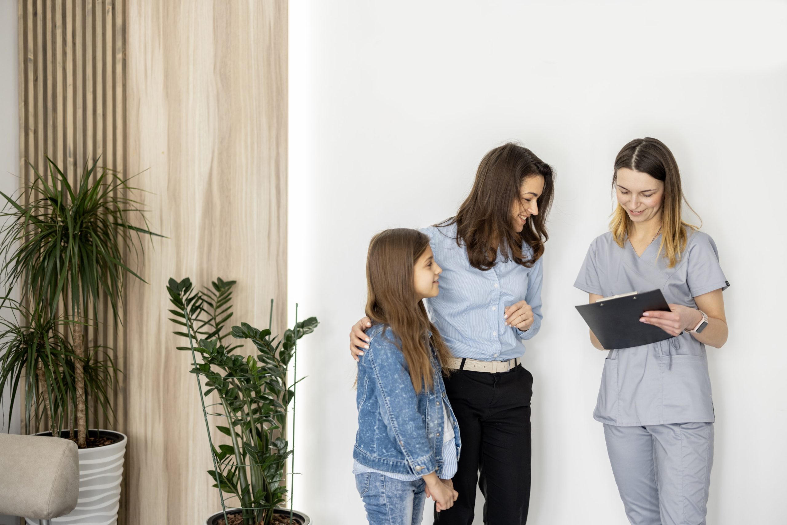 A family learning more about how impact orthodontics offer flexible financing options