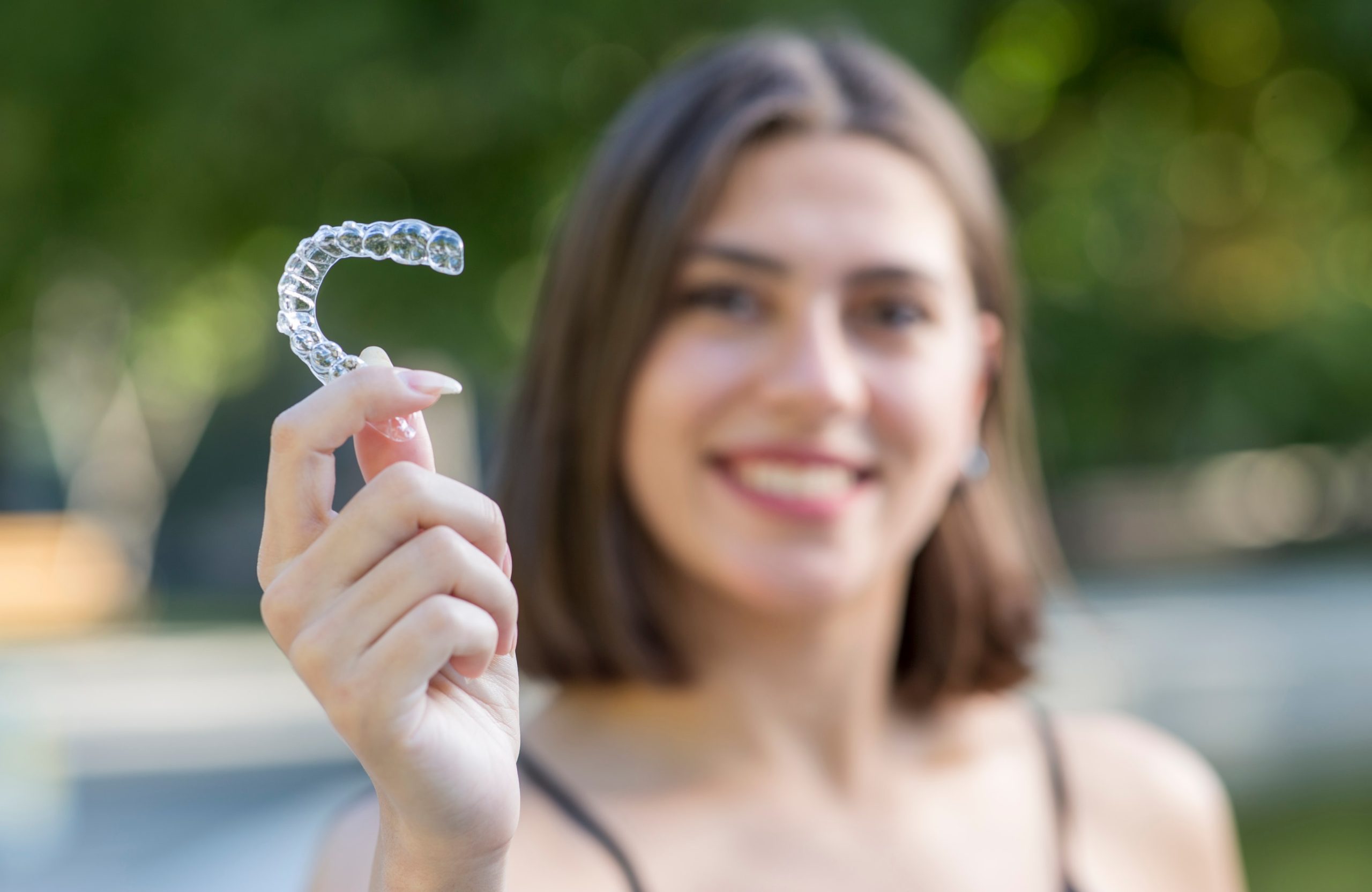 Woman smiling with Invisalign