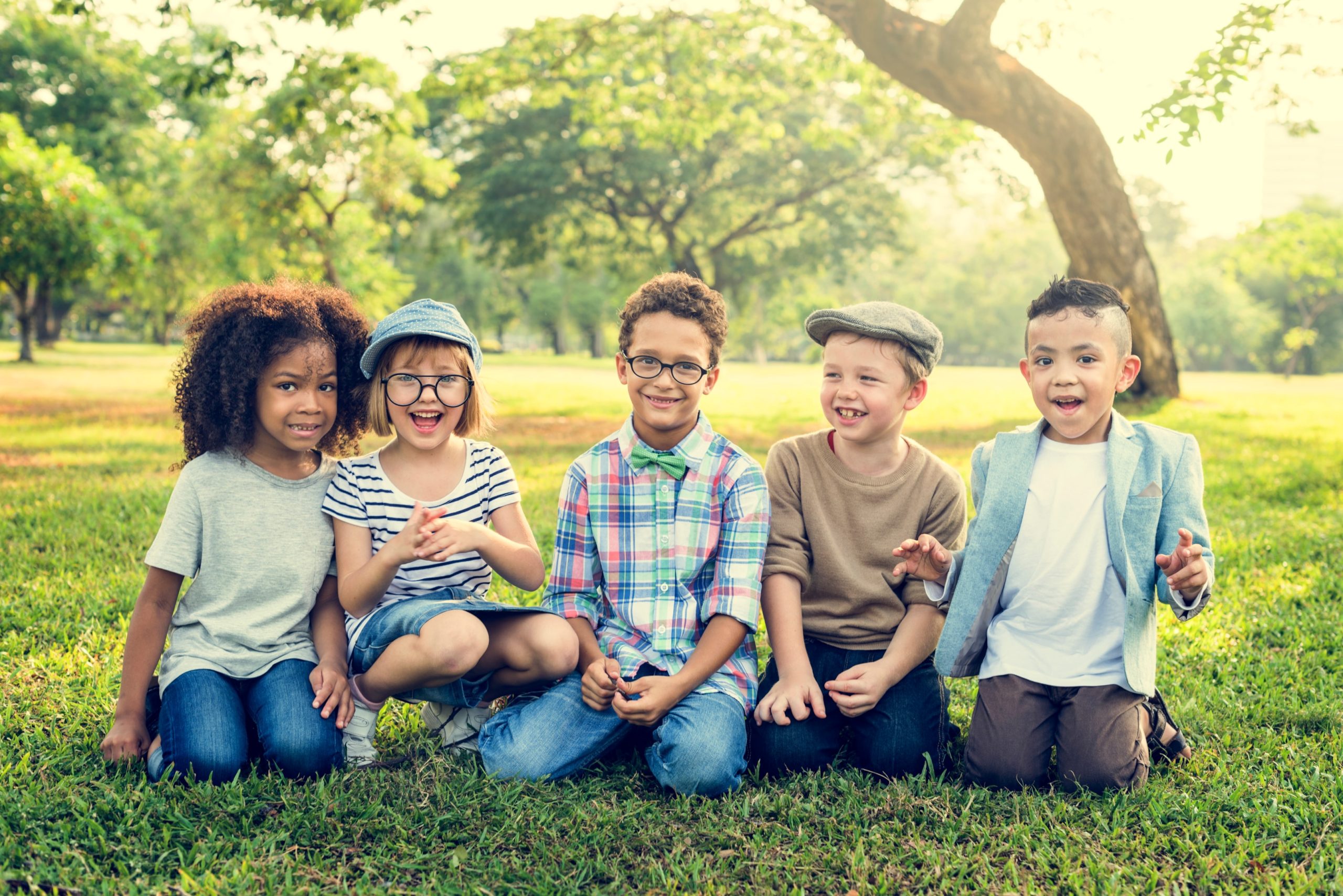 Kids smiling after getting Invisalign aligners