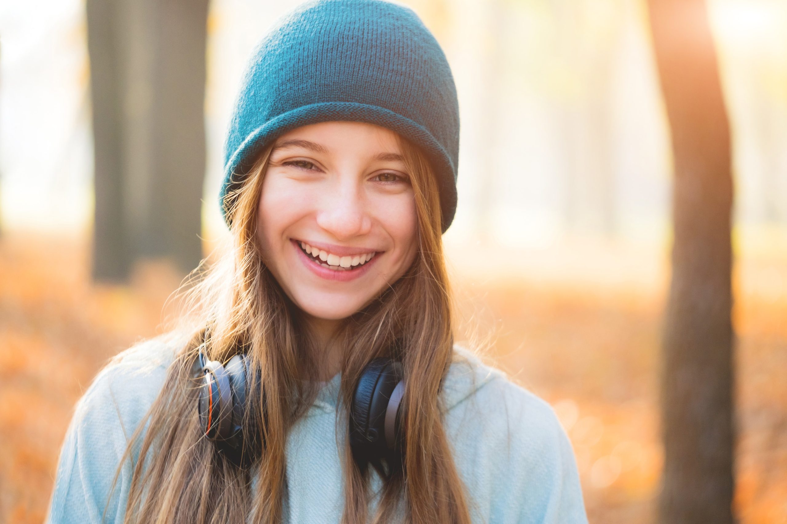 Kid smiling with straight teeth after orthodontic treatment