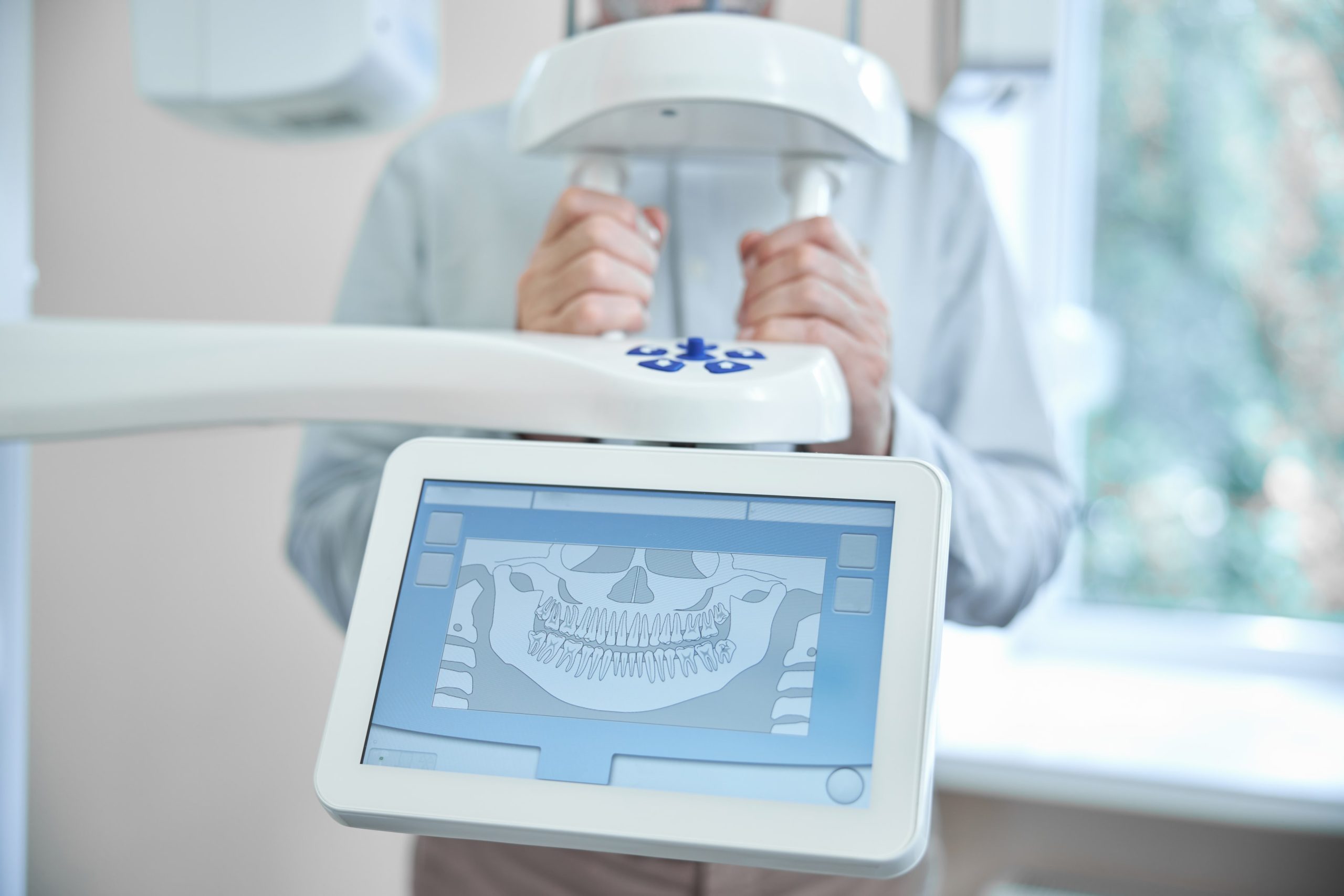 Patient of a dental clinic getting a panoramic dental x-ray used for orthodontic procedures