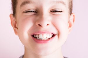 Girl smiling with crooked teeth