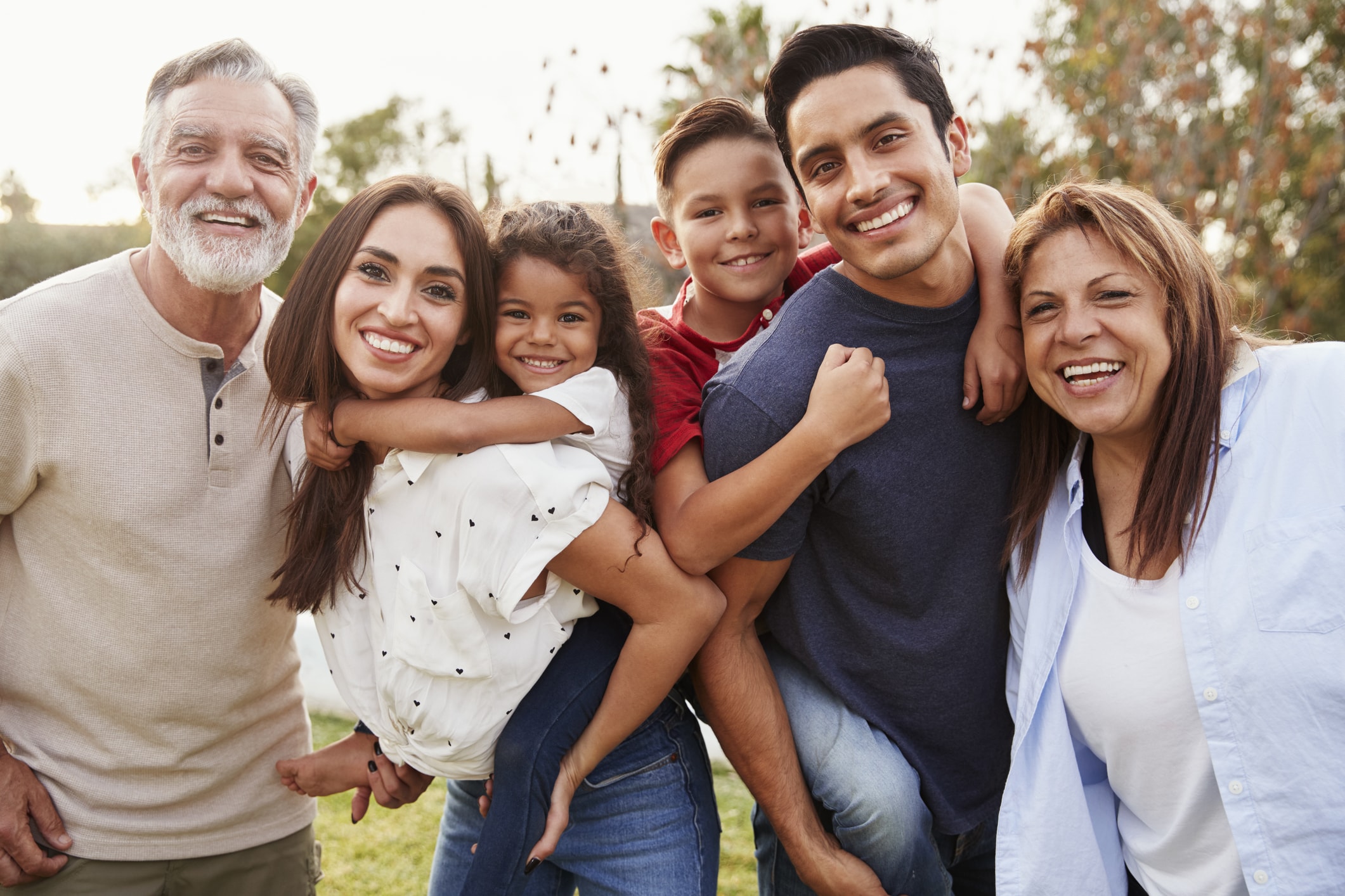 families smiling in a normal manner all with permanent molars