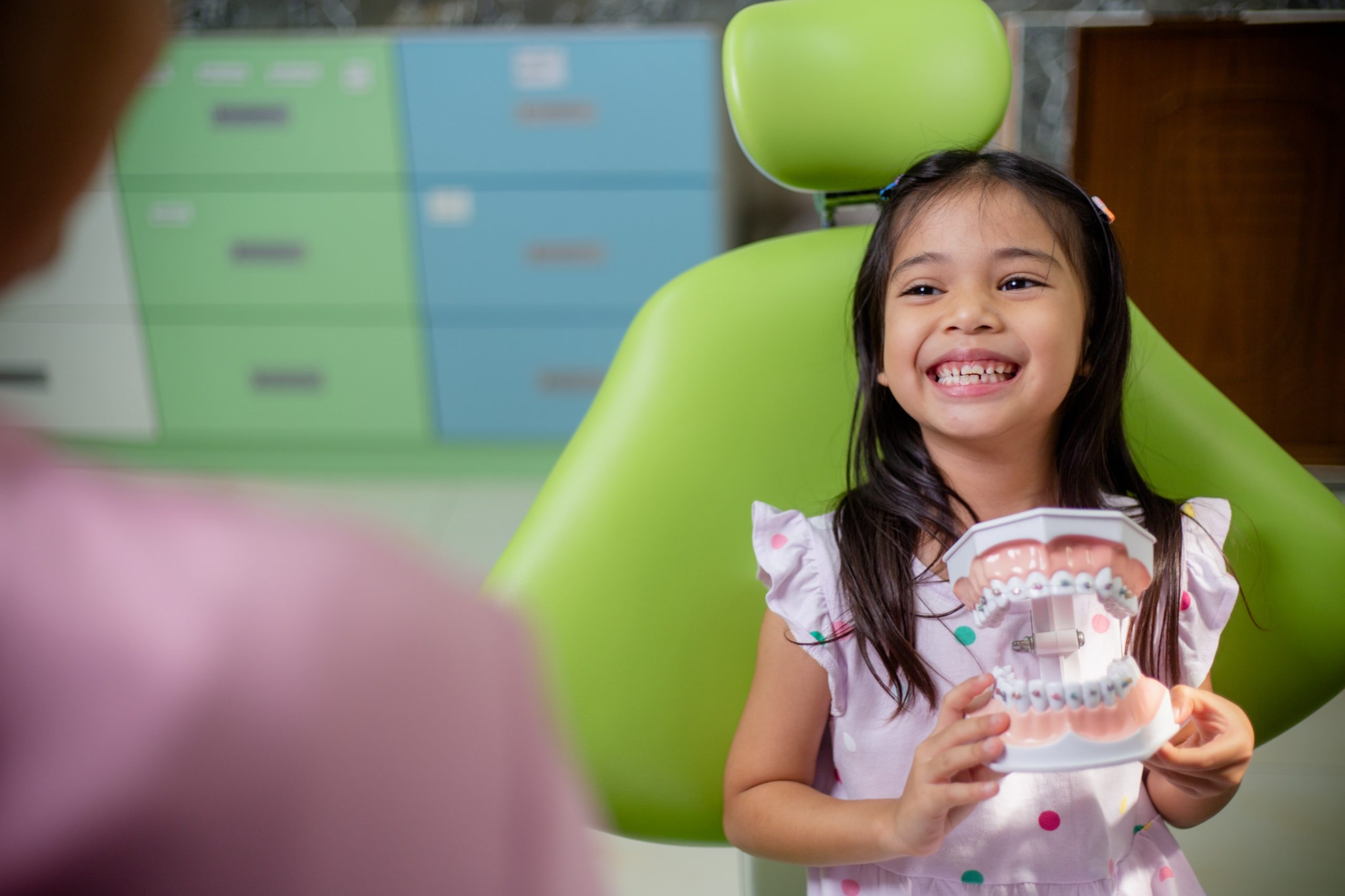 A young girl visiting the orthodontist for the first time