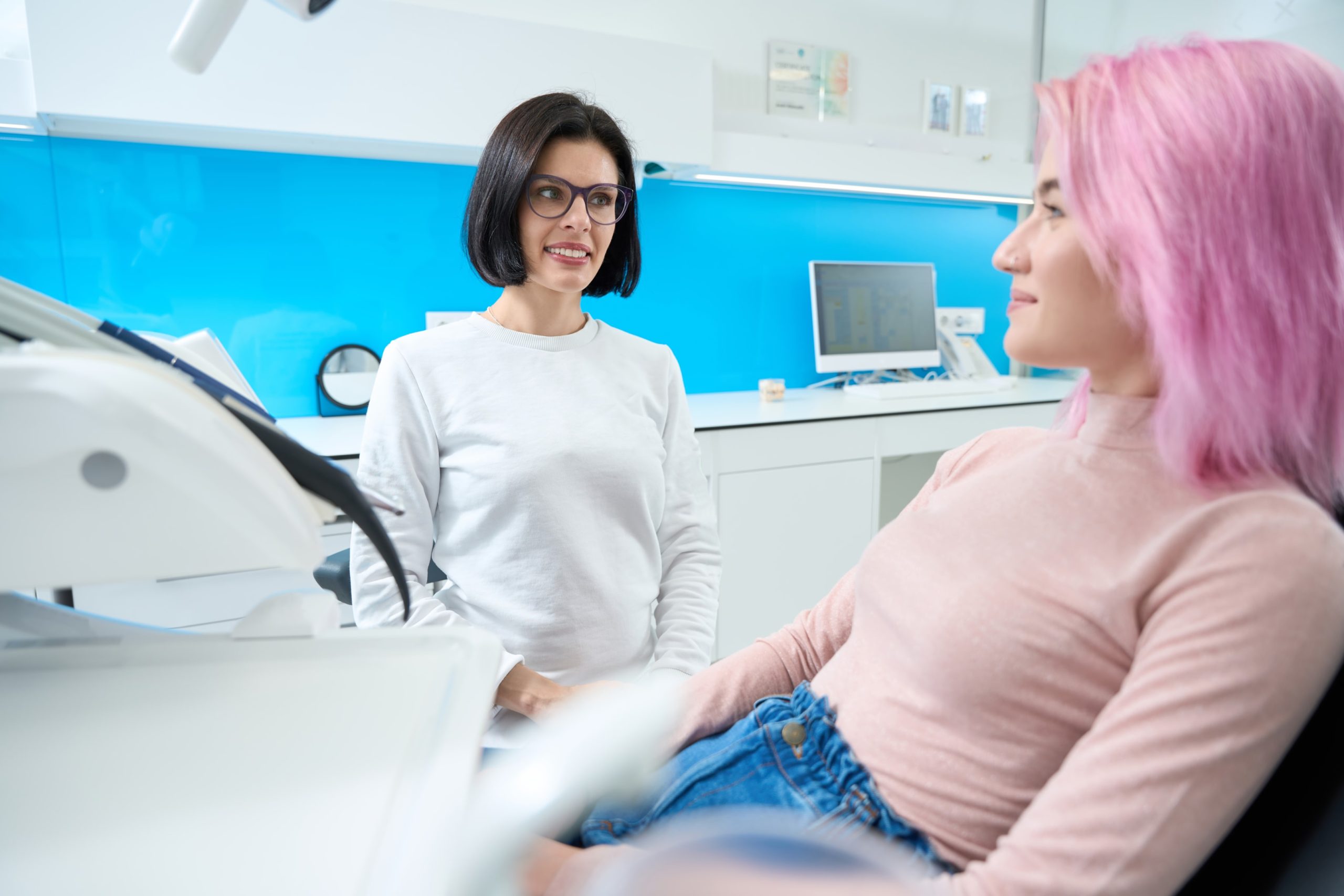 person getting consulted by orthodontist