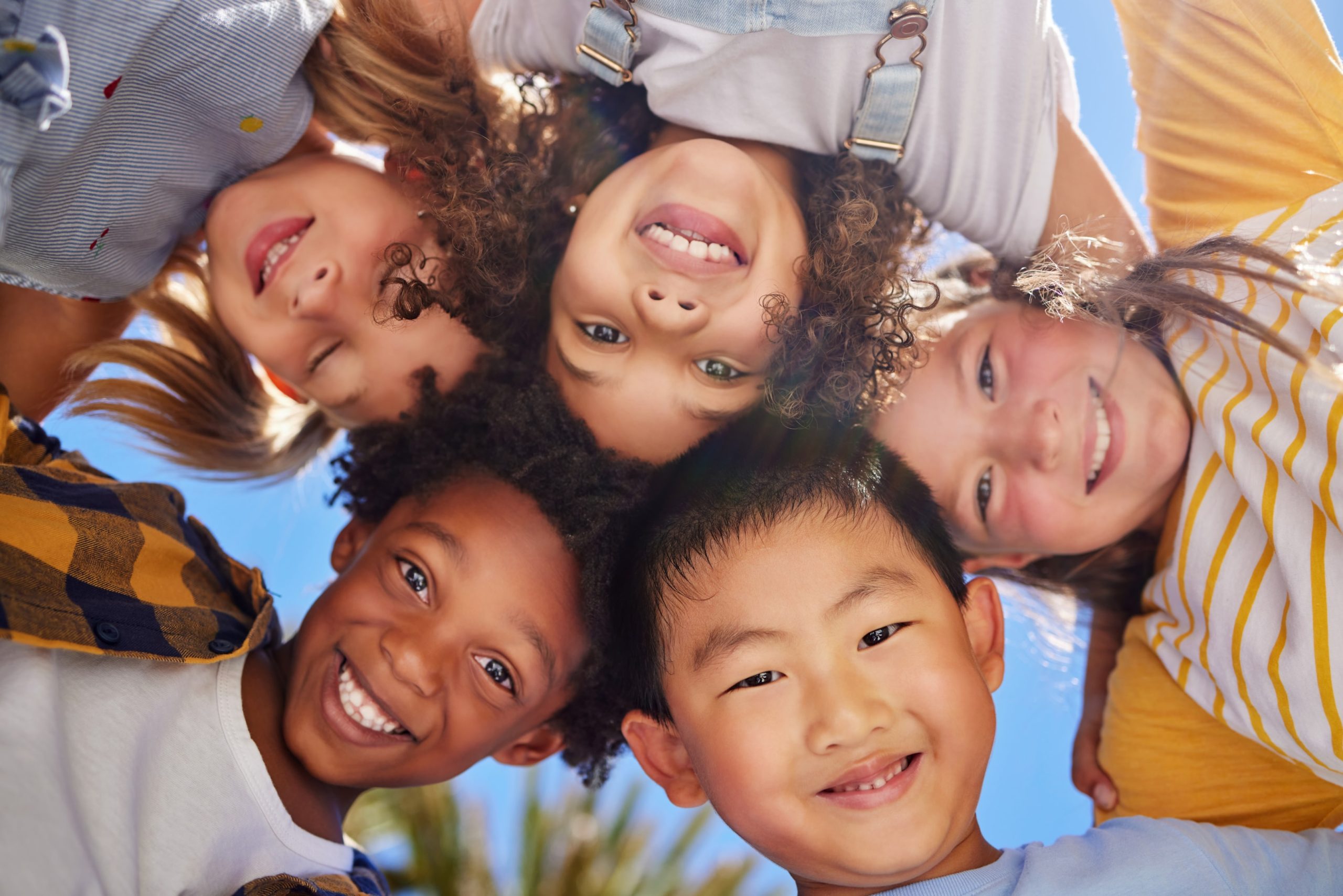 group of kids smiling after braces treatment