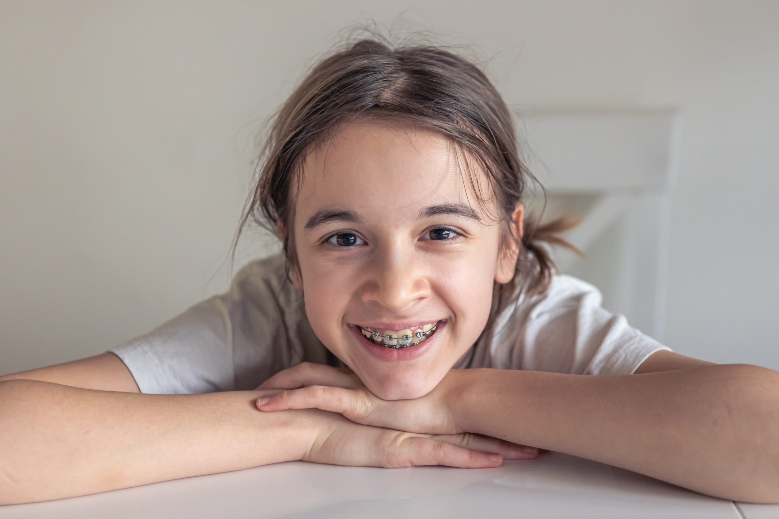 A young girl who just got her traditional braces.