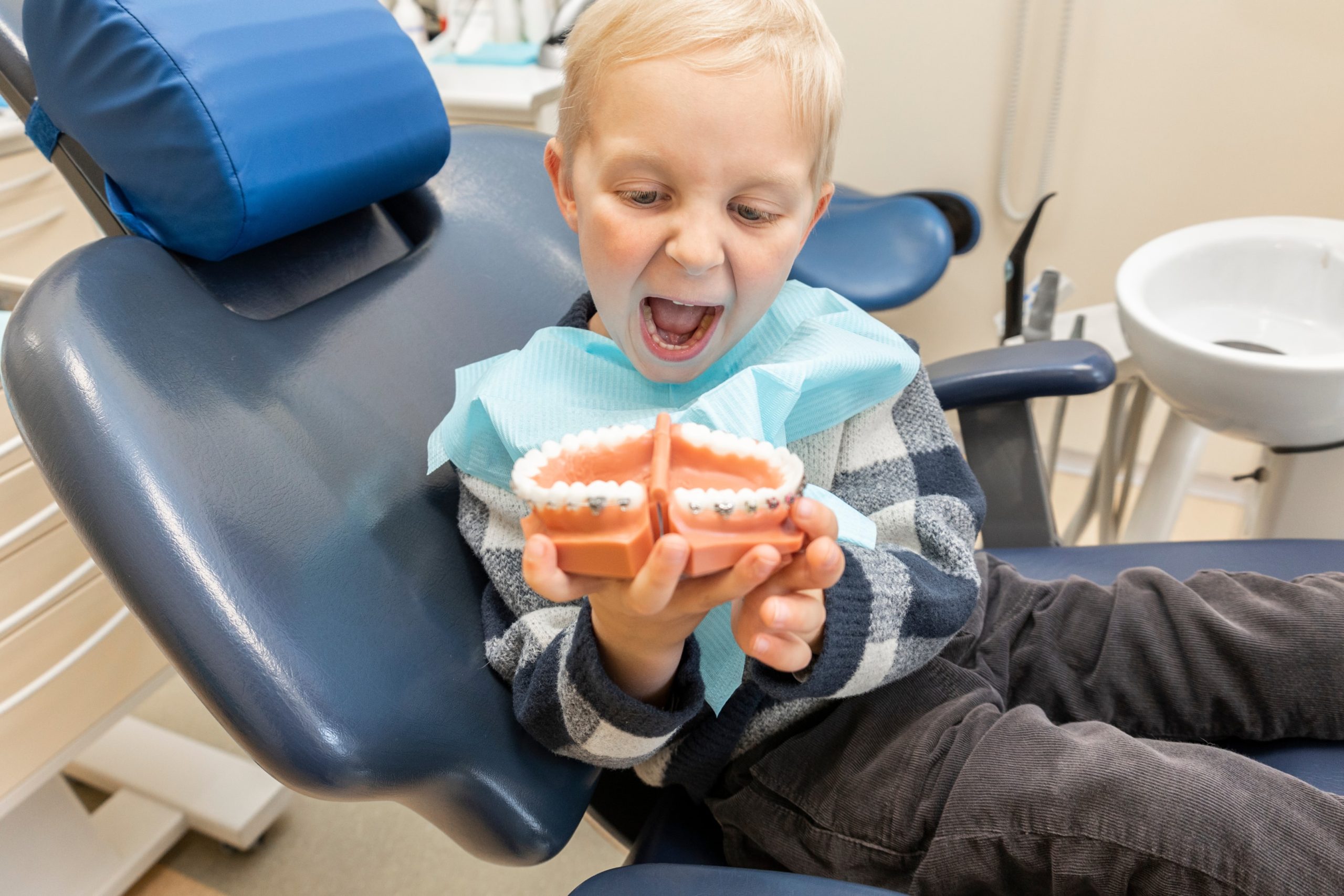 kid smiling at orthodontic office