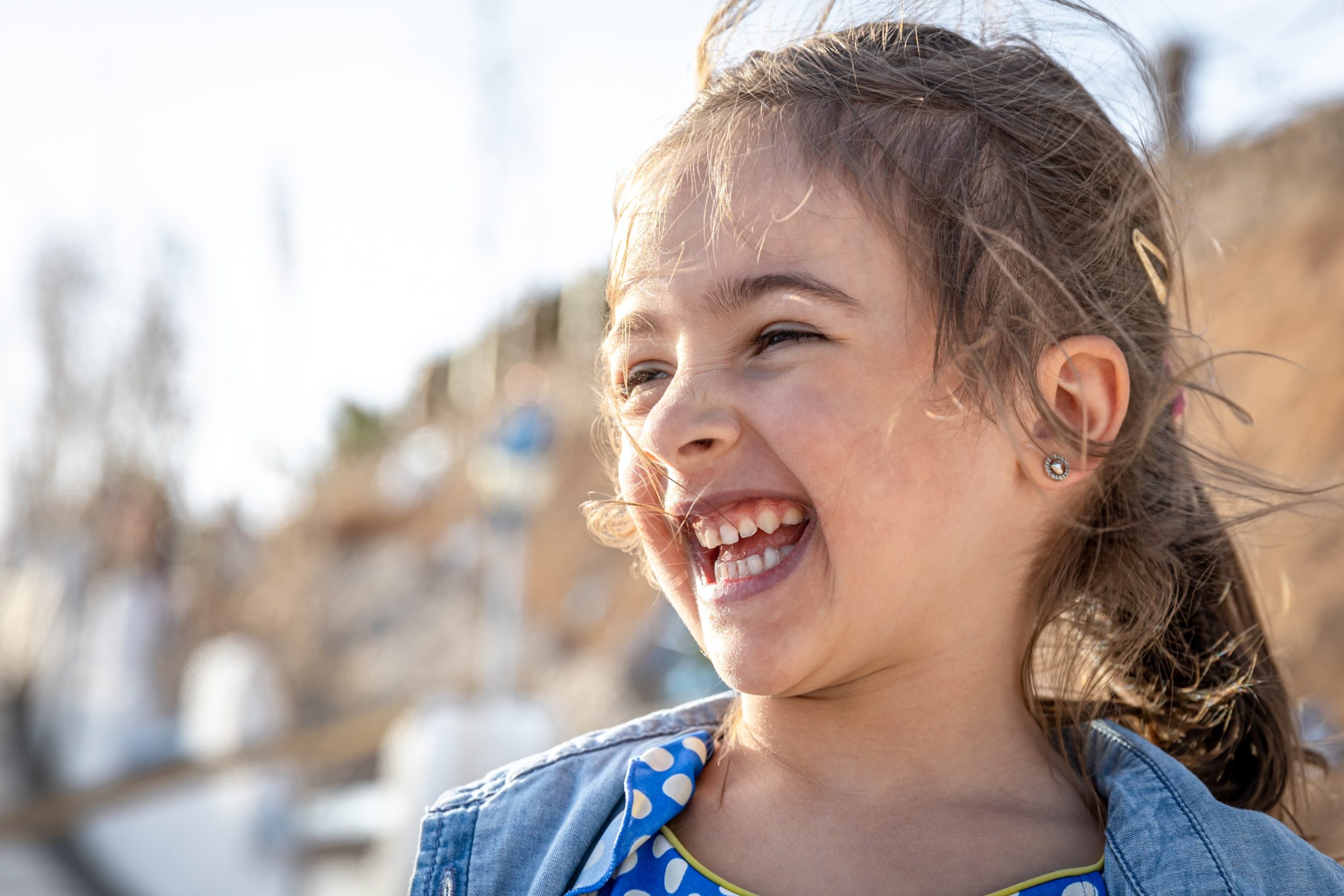 Kid smiling after having orthodontic jaw alignment services