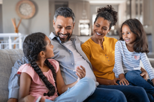 mother, father and two daughters happy with their calgary orthodontics