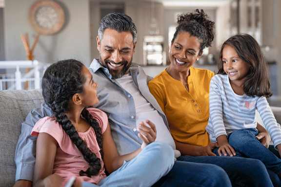 mother, father and two daughters happy with their calgary orthodontics 