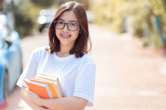 teen girl smiling showing her braces