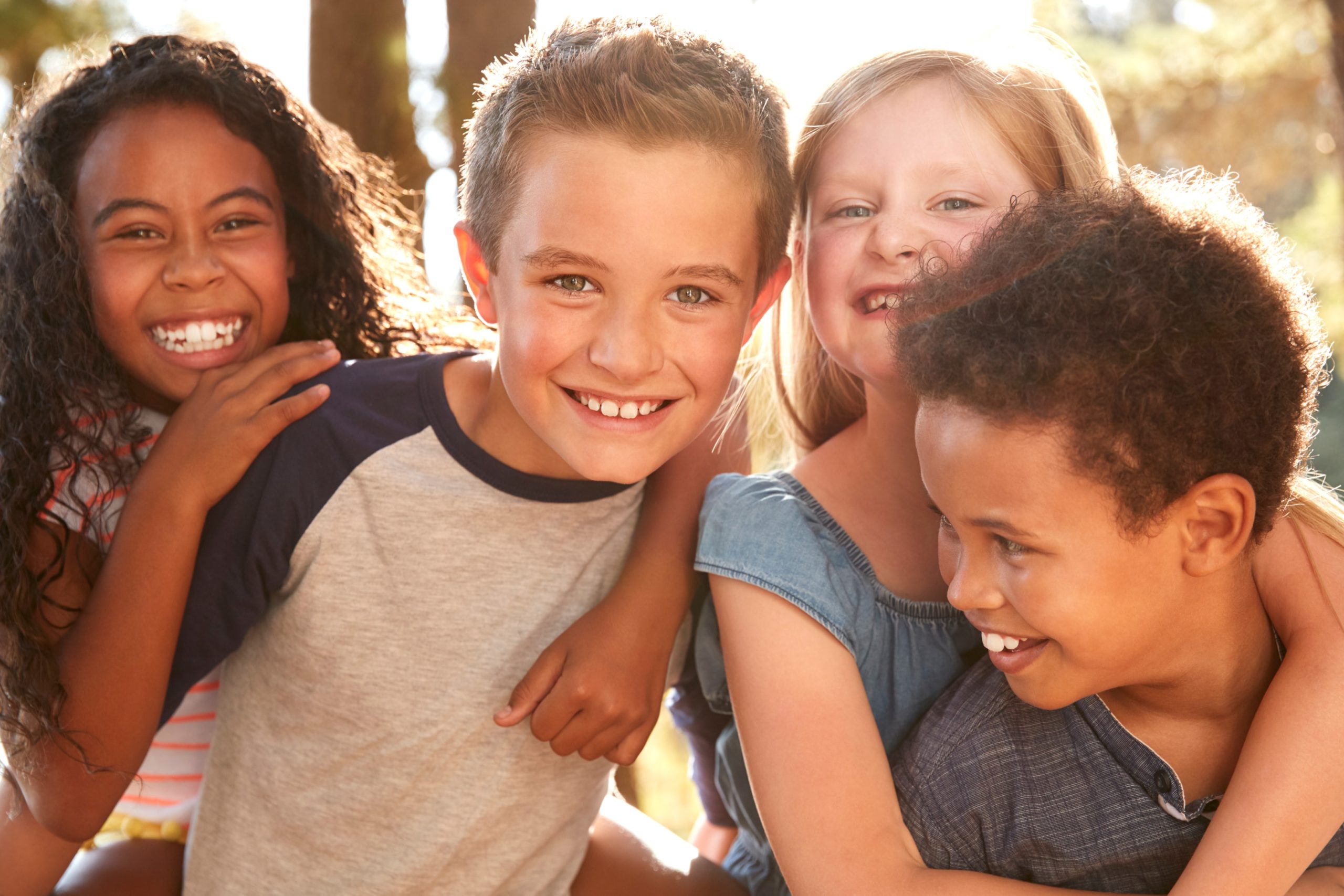 A smiling group of children who have had jaw alignment treatment