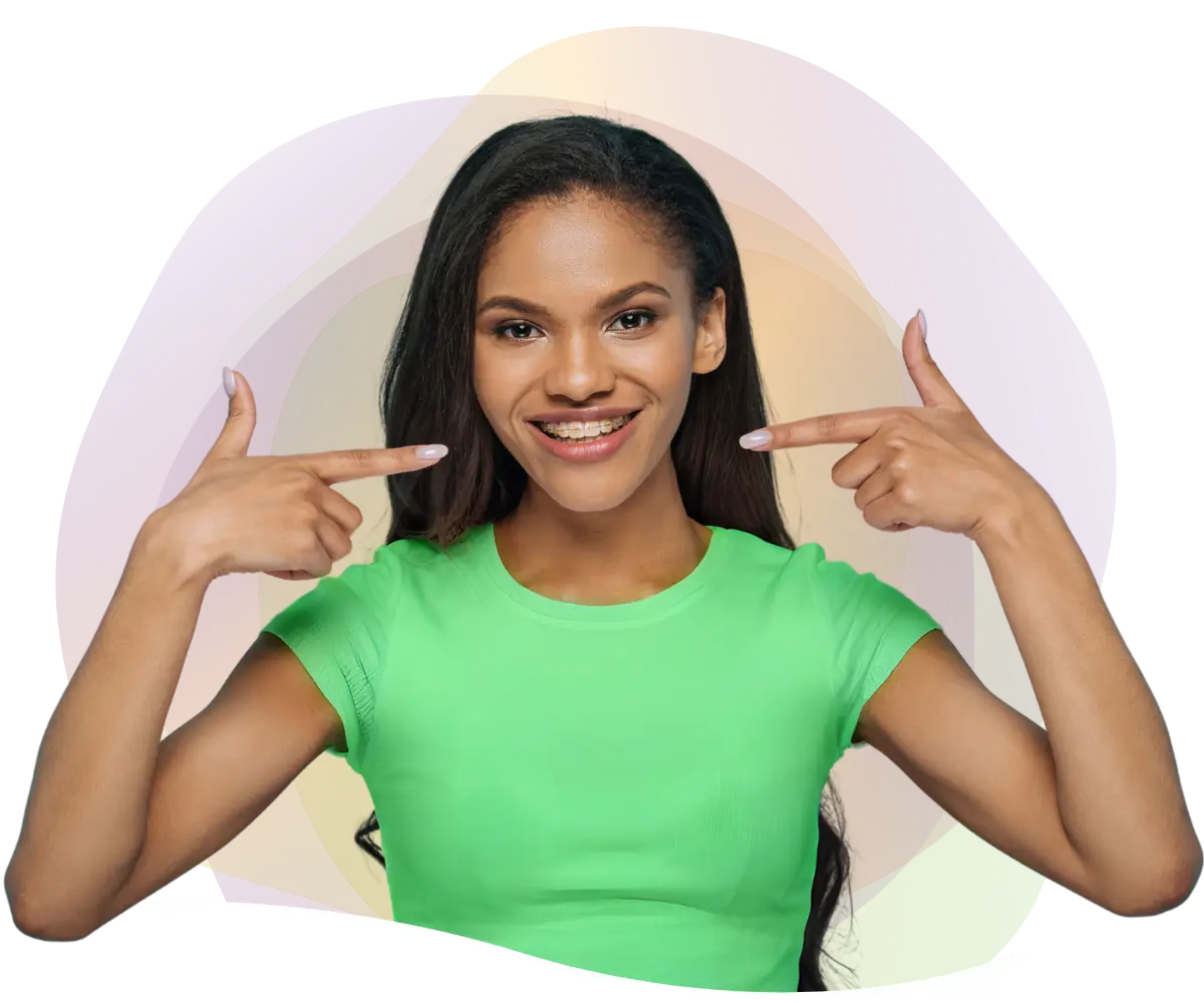 teenage girl with ceramic braces smiling