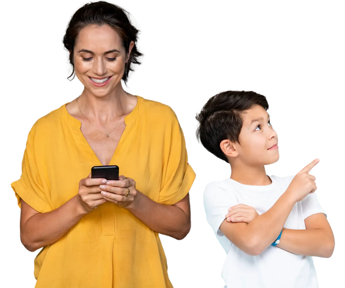 mother and son duo, mom is on her phone smiling and son is looking to the right and pointing
