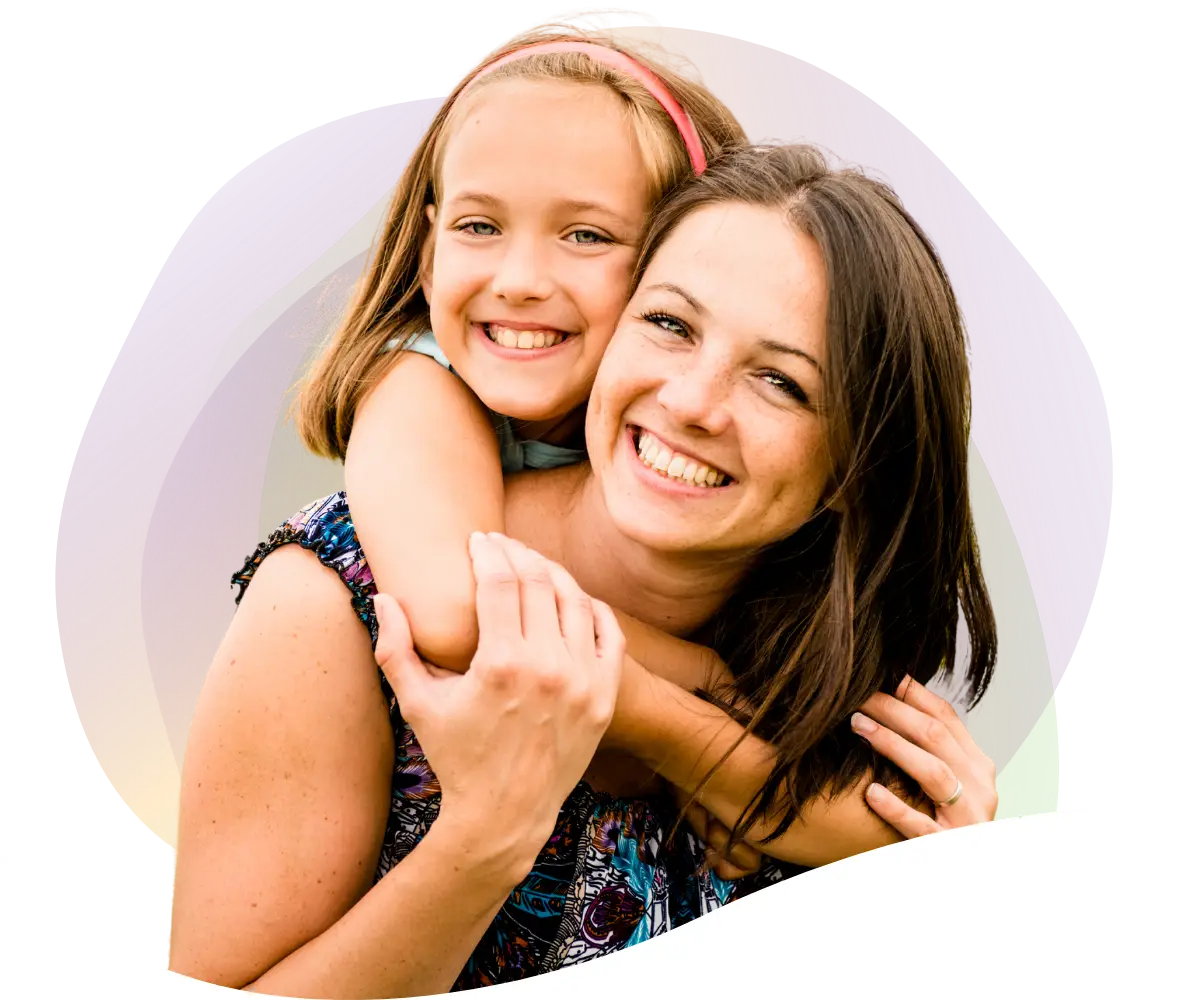 mother and daughter embracing and smiling