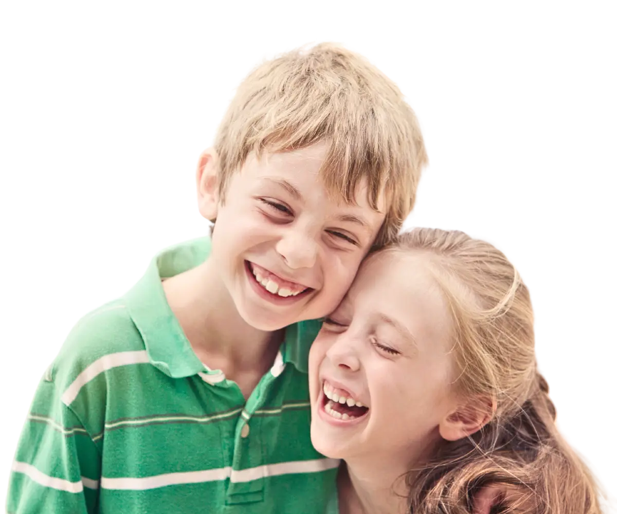 two siblings hugging and laughing