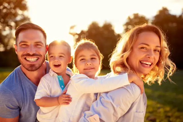 a smiling family happy that they decided to get the upper jaw of their daughter expanded