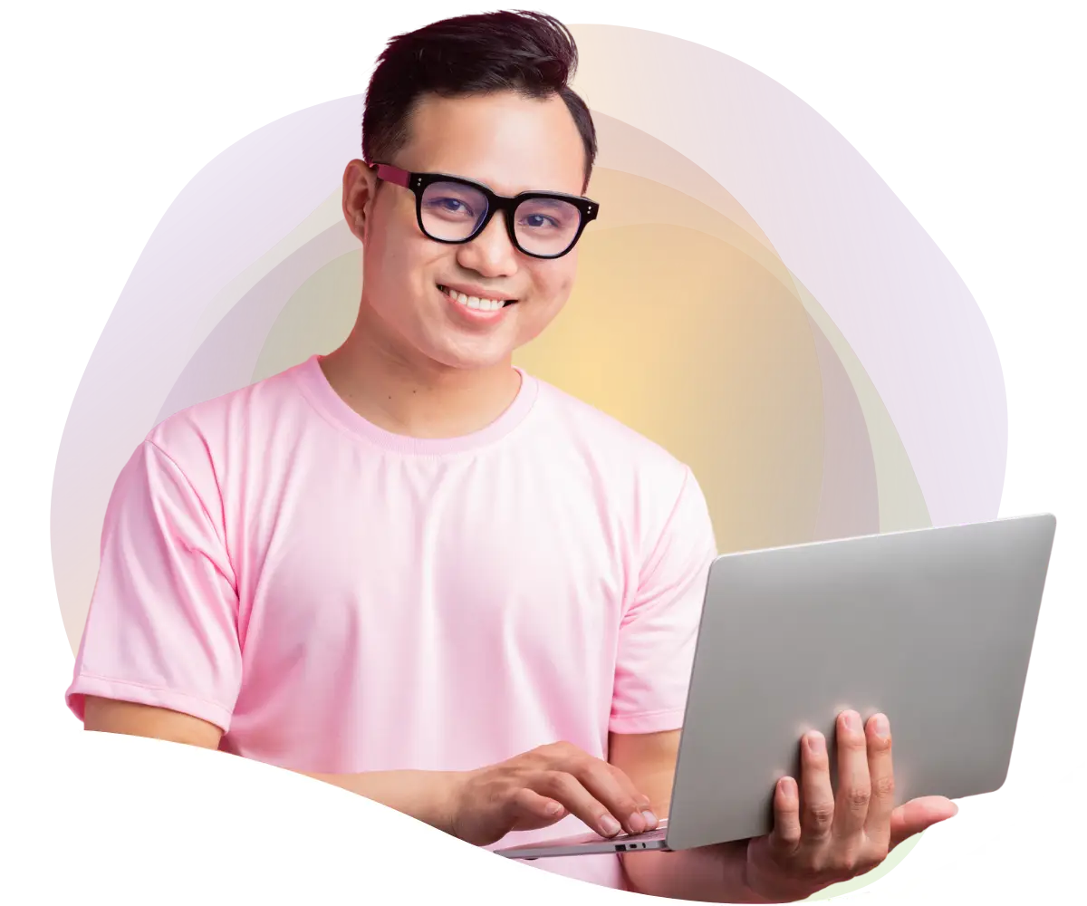 man in glasses smiling on a laptop looking at a sitemap