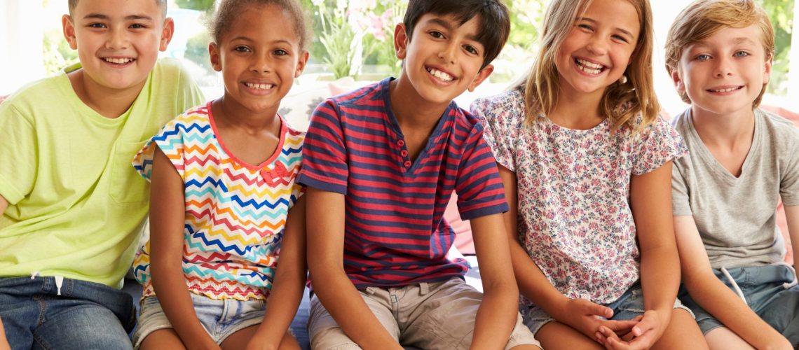 a group of smiling kids who are excited to start their orthodontic journey