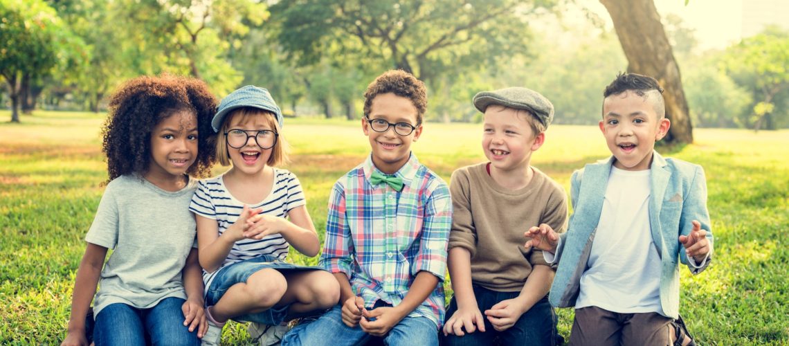 Kids smiling after getting Invisalign aligners