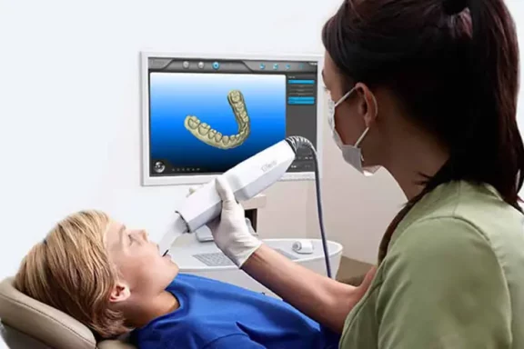 9409a9f1-250b-4a98-bb81-6c41276a88ec-1 child getting an itero scan of his teeth to prepare for orthodontic treatment