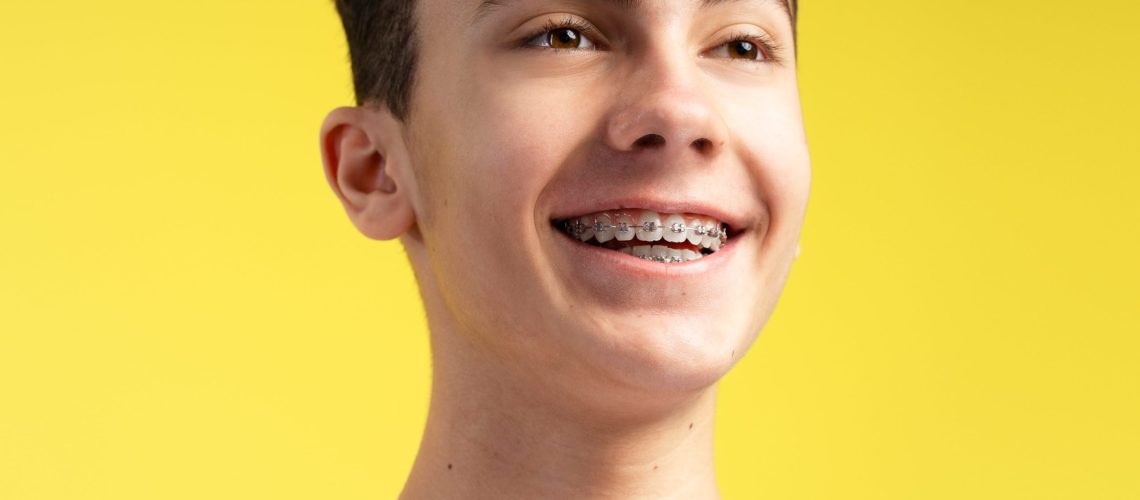 teenager smiling after getting braces