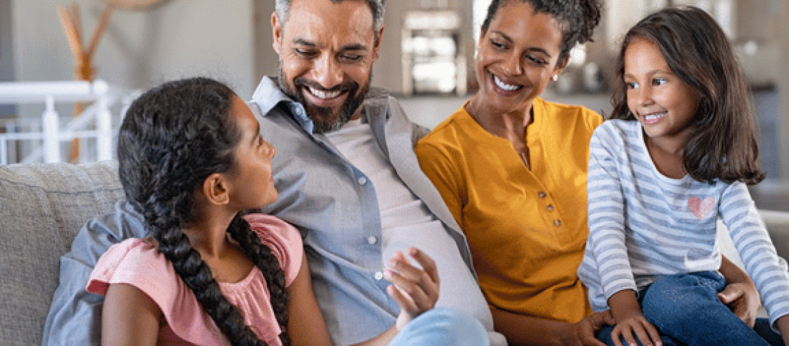 mother, father and two daughters happy with their calgary orthodontics