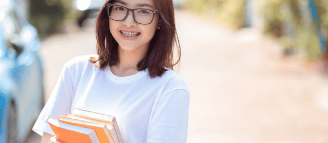 teen girl smiling showing her braces