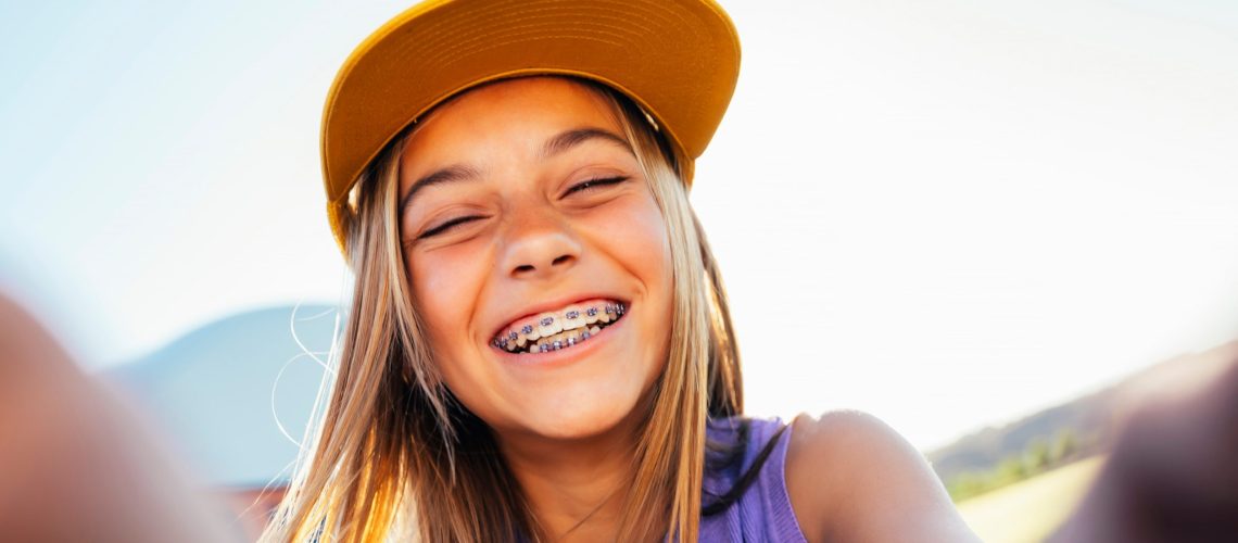 Kid wearing braces for a healthier smile